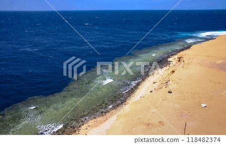 Sandy shore and wide underwater coastal reef near Big Brother Island, Red Sea, Egypt Sandy shore and wide underwater coastal reef near Big Brother Island, Red Sea, Egypt 118482374