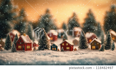 Snow-covered village with clock tower nestled in mountains during winter season 118482497