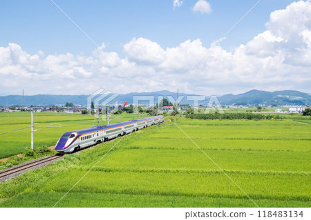[Yamagata Line] Shinkansen Tsubasa train running through rural scenery 118483134