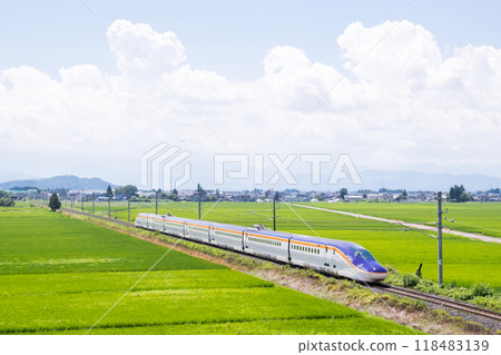 [Yamagata Line] Shinkansen Tsubasa train running through rural scenery 118483139