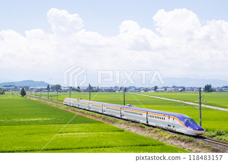 [Yamagata Line] Shinkansen Tsubasa train running through rural scenery 118483157