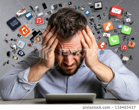 Stressed businessman having headache from social media overdose 118483437