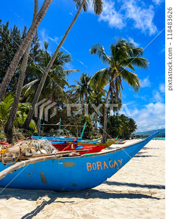 A fishing boat with boracay sign on the beach with palm trees in the background. High quality photo A fishing boat with boracay sign on the beach with palm trees in the background. High quality photo 118483626