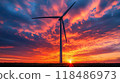 Gracefully rotating wind turbine silhouetted against a dramatic colorful sunset sky with clouds Renewable energy clean power and environmental sustainability concept 118486973