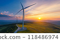 A wind turbine gracefully rotating against a dramatic sunset backdrop showcasing the power and beauty of renewable energy in a serene rural landscape 118486974