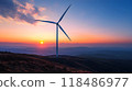 Majestic wind turbine elegantly rotating against a breathtaking sunset sky harnessing the power of renewable energy in a serene and captivating natural setting 118486977