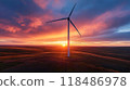 Graceful wind turbine smoothly rotating against a backdrop of a dramatic fiery sunset sky with clouds Renewable energy and sustainable technology concept 118486978