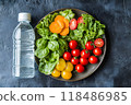 Refreshing Water Bottle Accompanied by Vibrant Vegetable Plate Symbolizing and Nourishment for a Balanced and Healthy Lifestyle 118486985