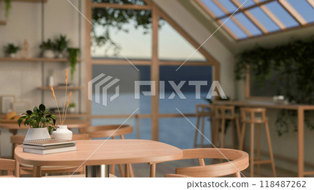 A close-up of a minimalist wooden table and armchair in a Scandinavian coffee shop. 118487262
