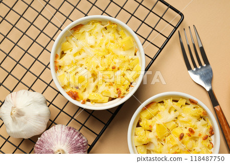Concept of tasty and delicious homemade food - potato casserole Concept of tasty and delicious homemade food - potato casserole 118487750