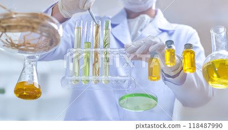 Experimental template with image of scientist using tweezers to pick up roots in a test tube, surrounded by herbal ingredients, extracts and experimental equipment in a modern laboratory. 118487990
