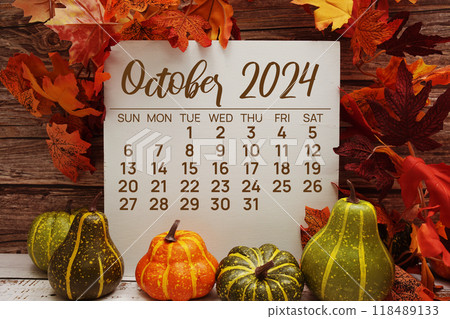 Autumn maple leaves decoration with wooden white board easel empty mockup space for text 118489133
