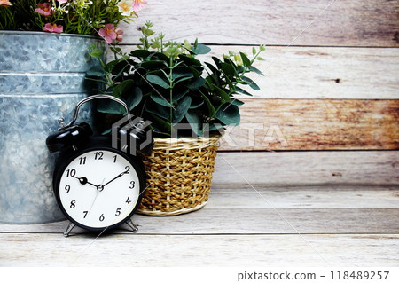 Vintage Alarm clock with space copy on wooden background 118489257