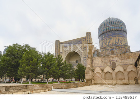 The entrance portal of the Bibi Khanum mosque decorated with majolica and mosaics of the XV century The entrance portal of the Bibi Khanum mosque decorated with majolica and mosaics of the XV century 118489617
