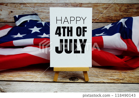 Happy 4th of July text messege with USA flag on wooden background 118490143