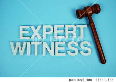 Expert Witness alphabet letters with wooden judge gavel on blue background Expert Witness alphabet letters with wooden judge gavel on blue background 118490178