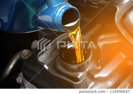 Refueling and pouring oil quality into the engine motor car Transmission and Maintenance Gear .Energy fuel concept. 118490687