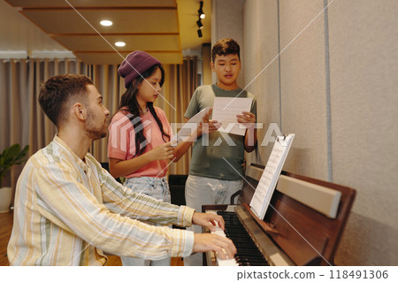 Practicing Music with Instructor at Piano Studio 118491306