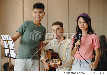 Group of Diverse Friends Enjoying Jam Session Together 118491331