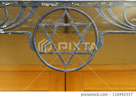 Star of David on a Jewish synagogue. Judaism, symbol, religion concept. Star of David on a Jewish synagogue. Judaism, symbol, religion concept. 118492557