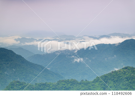 Tranquil mountains shrouded in mist. 118492606