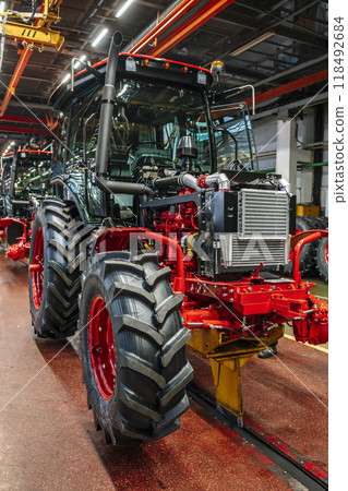 Tractor industry manufacture. New tractors on factory line. Production of agricultural machinery 118492684