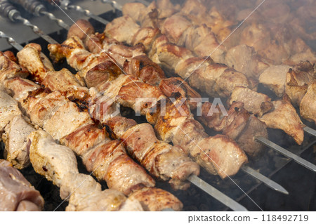 Kebab skewer meat dish. BBQ meat on grill.  118492719