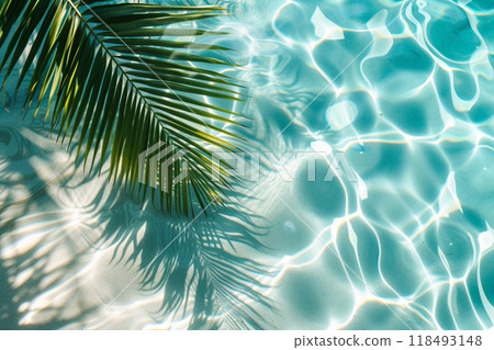 Palm branch against the background of clear sea water Palm branch against the background of clear sea water 118493148