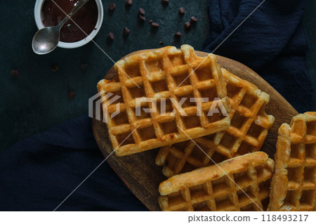 Belgian waffles on a dark background Belgian waffles on a dark background 118493217