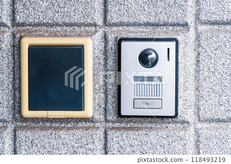Monitored intercom and combination lock at the front door Monitored intercom and combination lock at the front door 118493219