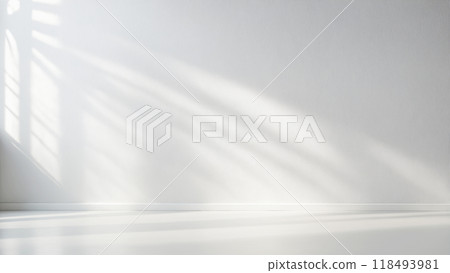 Minimalistic light background with blurred foliage shadow on white wall Minimalistic light background with blurred foliage shadow on white wall 118493981