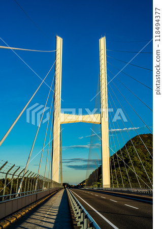 Sunrise over Megami Ohashi Bridge [Nagasaki City] 118494377