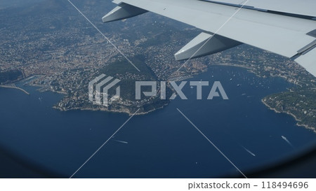 Spectacular view from an airplane's window above Nice, offering a view of lovely clouds 118494696