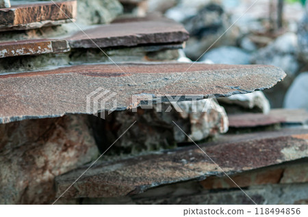 Close-Up of Layered Natural Stone Slabs in Outdoor Setting Close-Up of Layered Natural Stone Slabs in Outdoor Setting 118494856