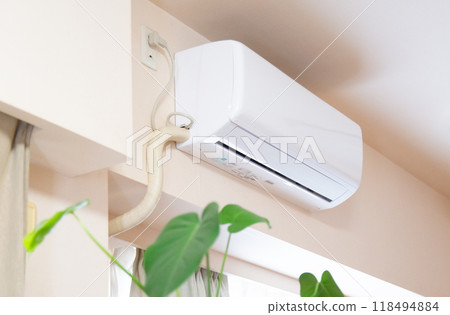 A home air conditioner and houseplants installed indoors A home air conditioner and houseplants installed indoors 118494884