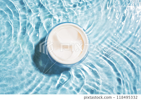 Cosmetic cream in blue water Cosmetic cream in blue water 118495332