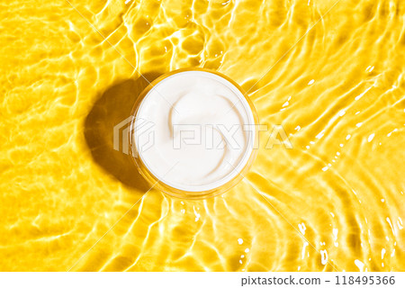 Cosmetic beauty cream in yellow water 118495366