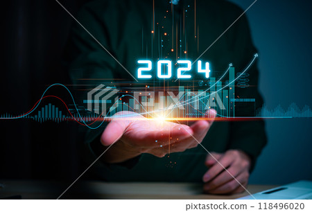 Businessman hand holding the increase arrow graph corporate future growth year 2023 to 2024. New Goals with Plans and Visions for Next Year 2024, Opportunity, challenge and business strategy. Businessman hand holding the increase arrow graph corporate future growth year 2023 to 2024. New Goals with Plans and Visions for Next Year 2024, Opportunity, challenge and business strategy. 118496020
