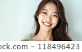 A special photographic mirror-headed, happy-year-old woman from Asia, 20 years old, with an exposed smile, isolated on a meek blue background. skin care, plastic surgery, 118496423