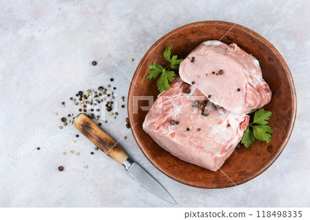 Raw cuts of pork meat. 118498335