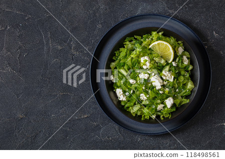 Classic Greek green lettuce salad with feta cheese 118498561