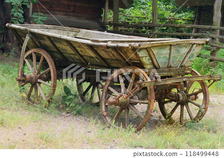 Antique wooden cart. Rustic transport in nature landscape. 118499448