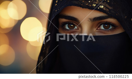 A woman wearing a veil with intense focus in her eyes 118500225