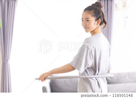 Beautiful woman exercising at home Beautiful woman exercising at home 118501148