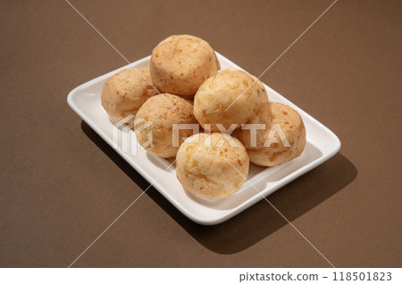 stack of Brazilian pao de queijo mineiro, brownbackground stack of Brazilian pao de queijo mineiro, brownbackground 118501823