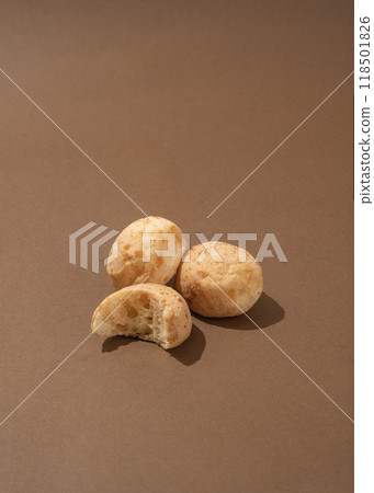 Brazilian cheese breads on the brown background Brazilian cheese breads on the brown background 118501826