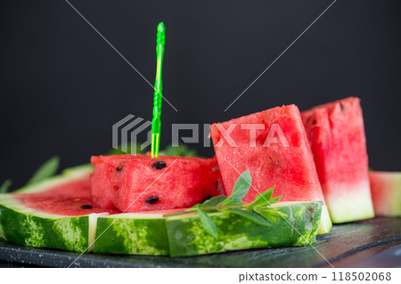 pieces of ripe red watermelon, close-up, on a board pieces of ripe red watermelon, close-up, on a board 118502068