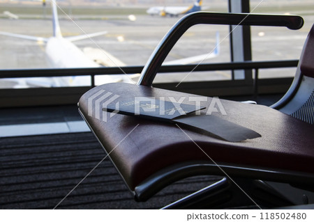 The Ukrainian biometric passport on the waiting place in the airport 118502480
