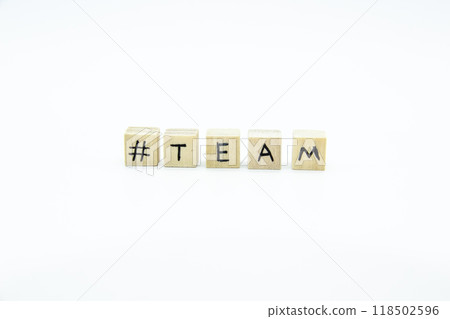 Word TEAM written on the wood cubes on white background. The concept photo with letters #team Word TEAM written on the wood cubes on white background. The concept photo with letters #team 118502596