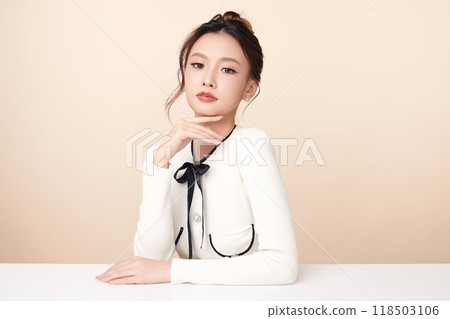 Beautiful young asian woman with clean fresh skin on beige background, Face care, Facial treatment, Cosmetology, beauty and spa, Asian women portrait. Beautiful young asian woman with clean fresh skin on beige background, Face care, Facial treatment, Cosmetology, beauty and spa, Asian women portrait. 118503106